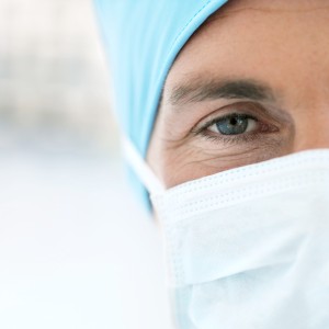 Young Male Doctor Wearing Protective Headgear and Face Mask
